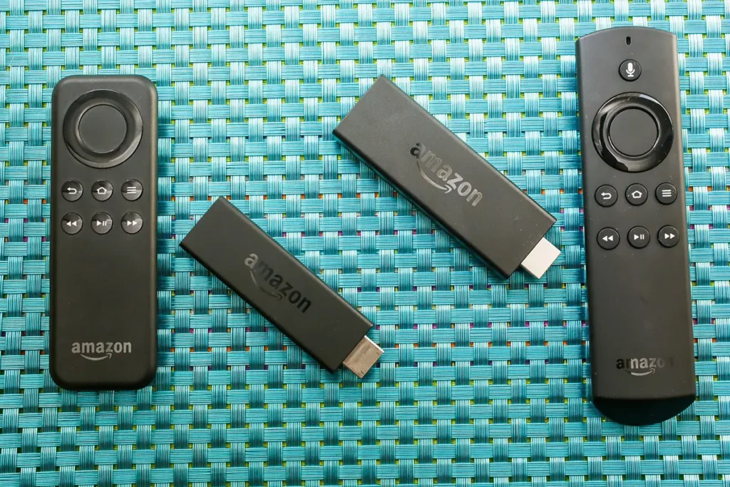 Image of amazon fire stick and hdmi remote on a green woven place mat