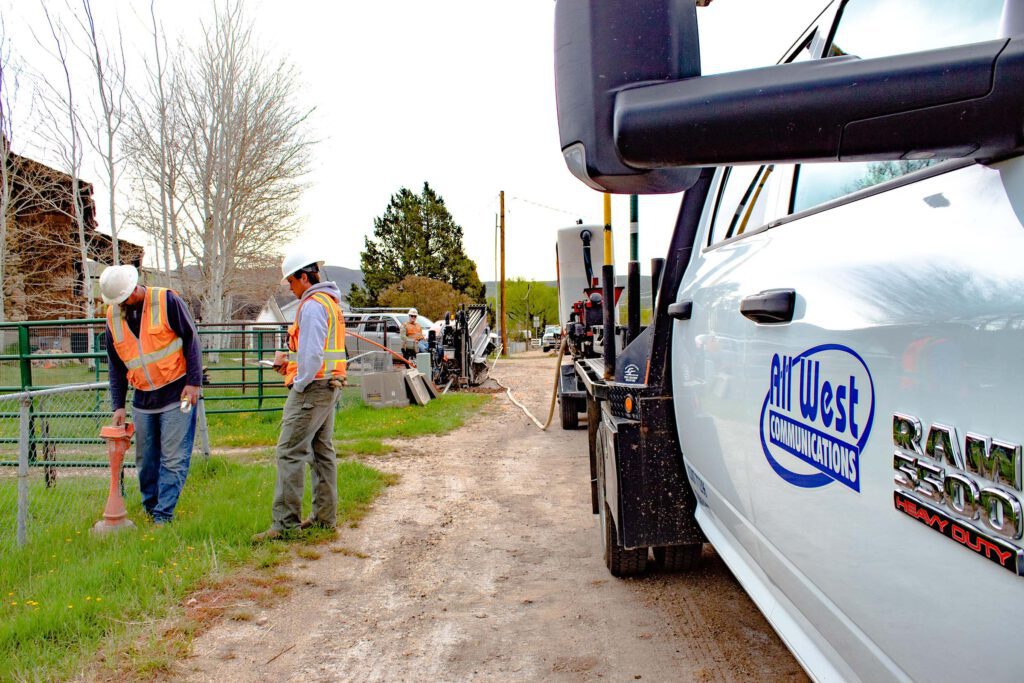 All West workers at a construction project beside a road