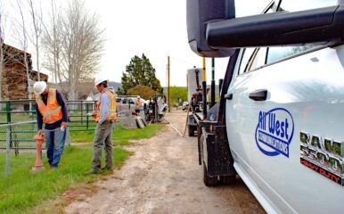 All West workers at a construction project beside a road