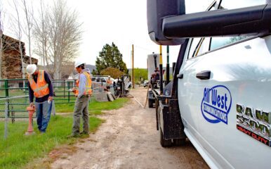 All West workers at a construction project beside a road