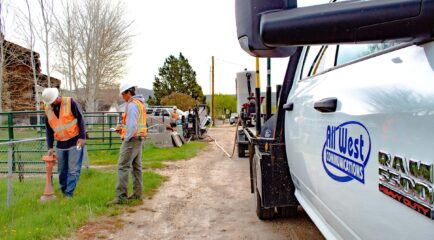 All West workers at a construction project beside a road