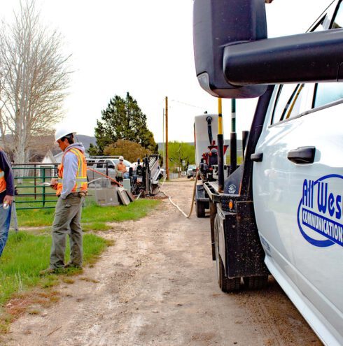 All West workers at a construction project beside a road