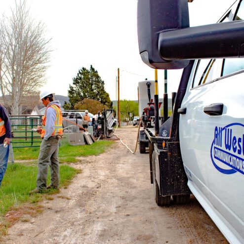 All West workers at a construction project beside a road