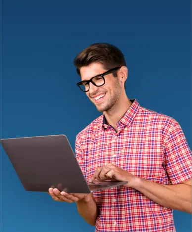 Man in a checkered shirt holding a laptop