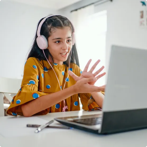 Girl using a laptop to study