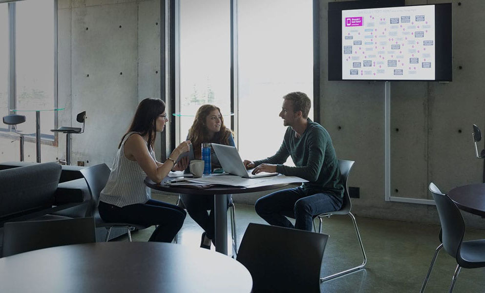 coworkers talking at a table