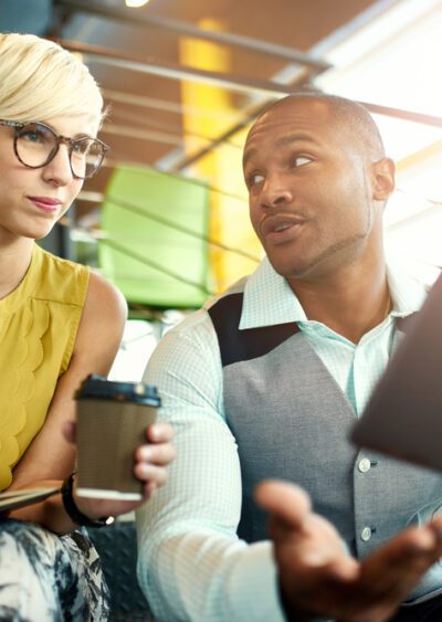 Two young workers talking