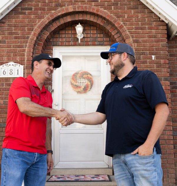 Customer shaking hands with an AllWest technician