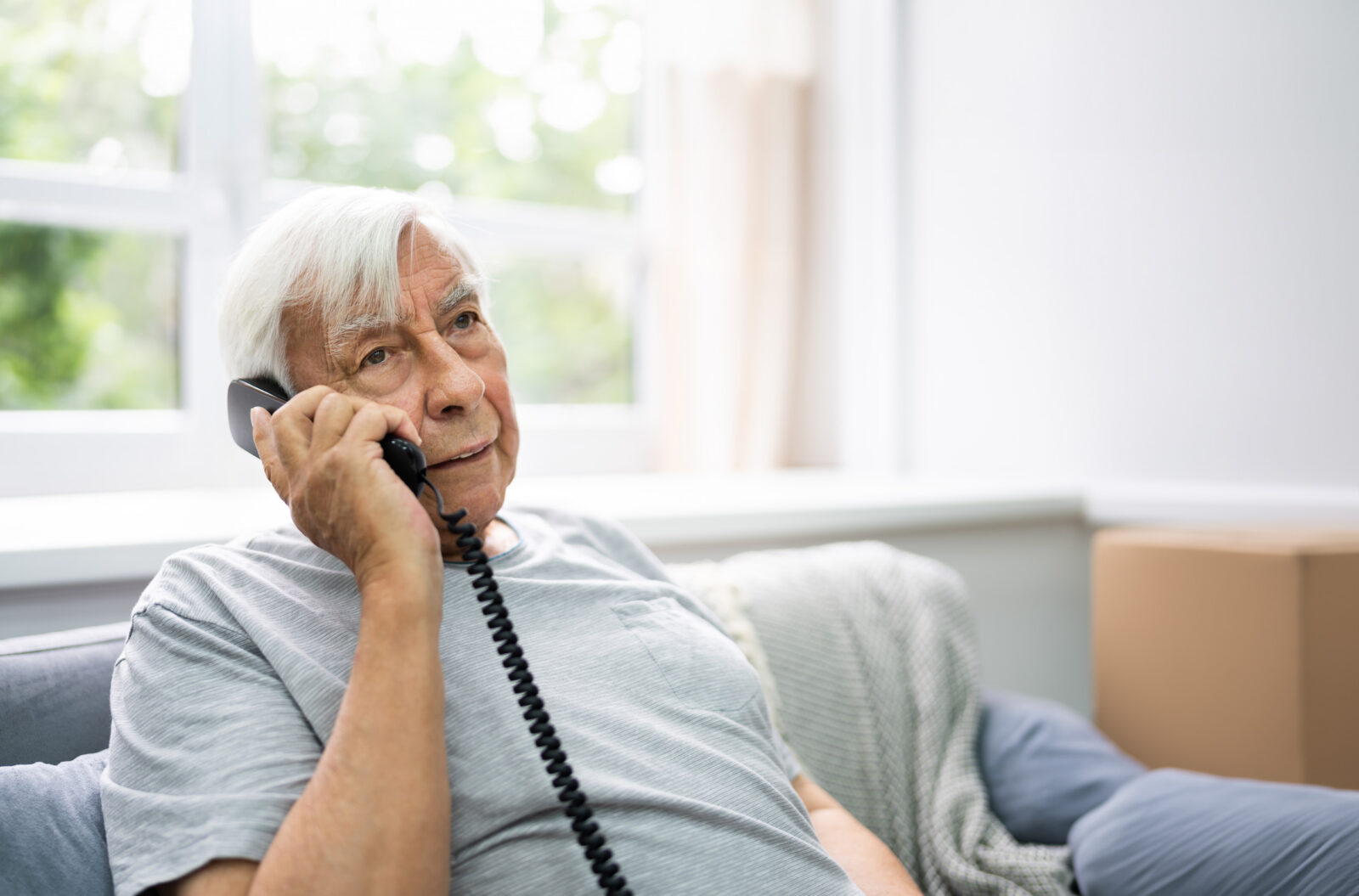 older man talking on the phone