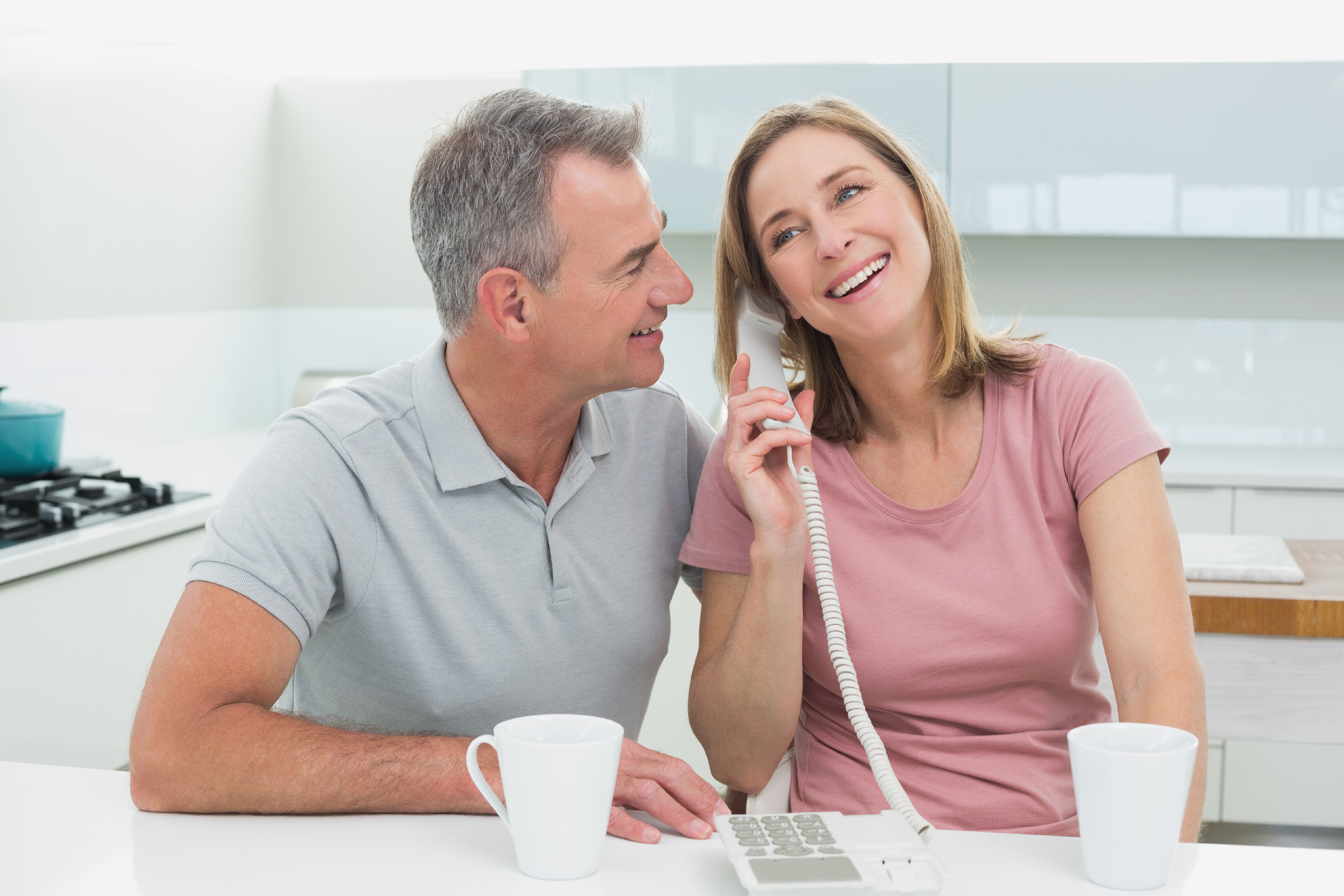 a man and woman talking on the phone