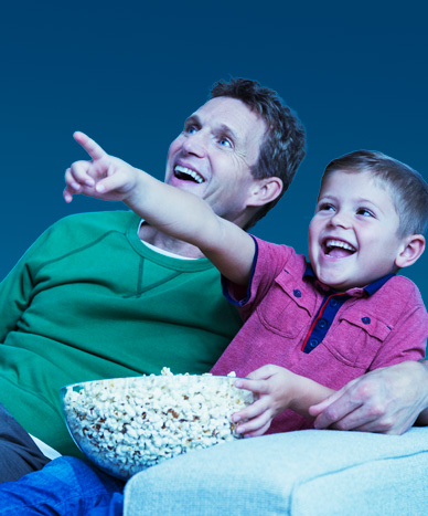 a father and son watching TV