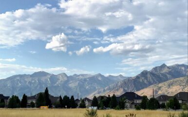 Homes in a Mountain West community with mountains in the background