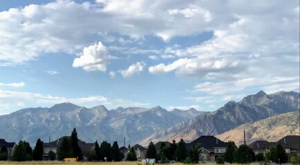 Homes in a Mountain West community with mountains in the background